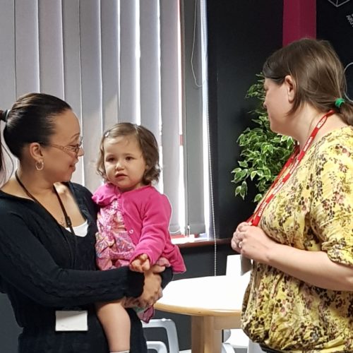 Three people attending a Maternity Voices Partnership meeting.